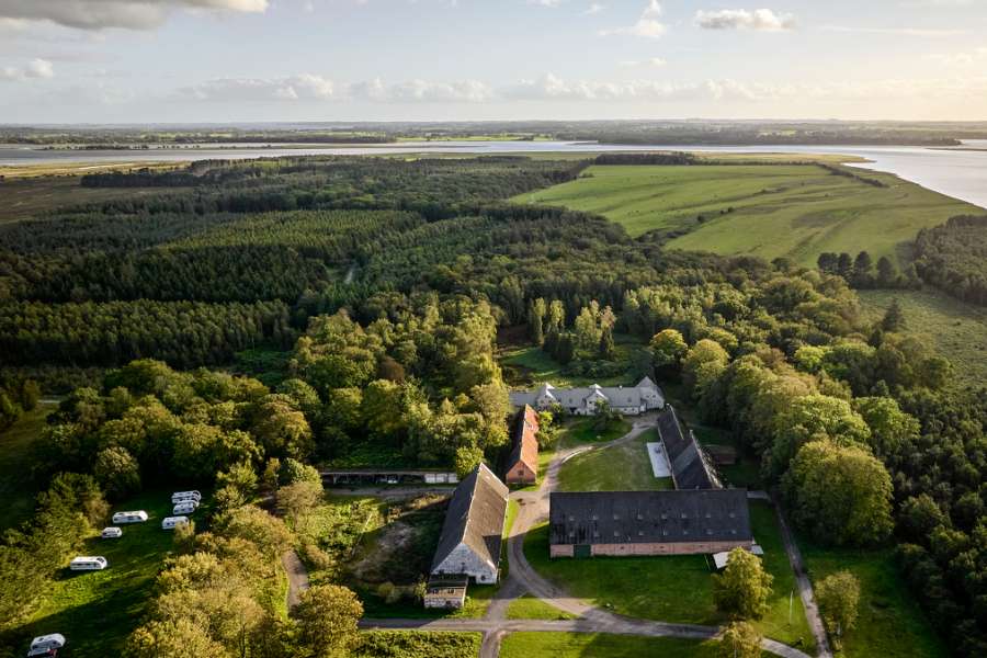 Zooming across the renovated Faxe manor with a new steel roof, Feddet 27, 4640 Faxe, Denmark